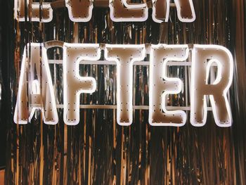 Directly above shot of text on wood