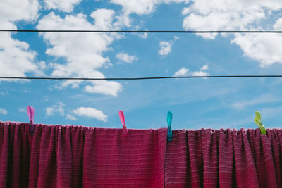 Low angle view of multi colored roof against sky