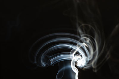 Close-up of smoke against black background