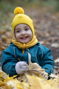 Portrait of smiling boy in snow