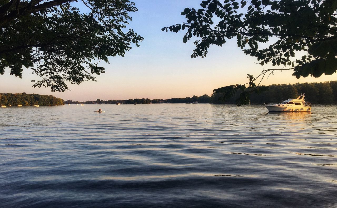 SCENIC VIEW OF LAKE AT SUNSET