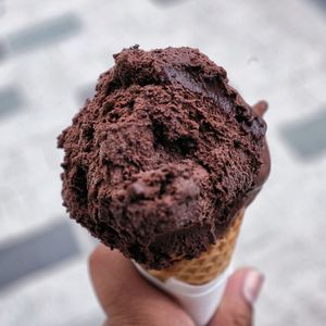 Close-up of hand holding ice cream