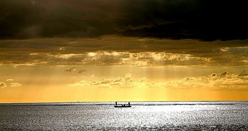 Scenic view of sea at sunset