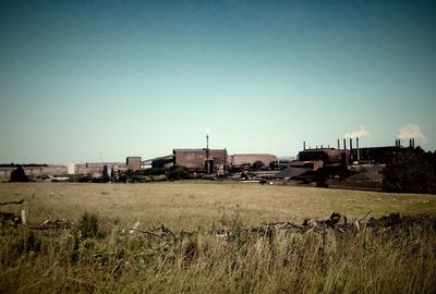 View of rural landscape against clear sky