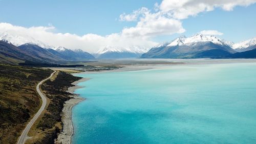 Scenic view of lake and mountains against sky