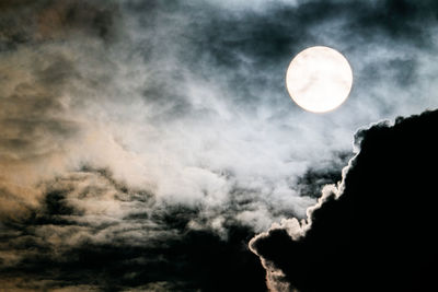 Low angle view of moon against sky at night