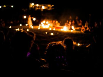 People enjoying concert at night