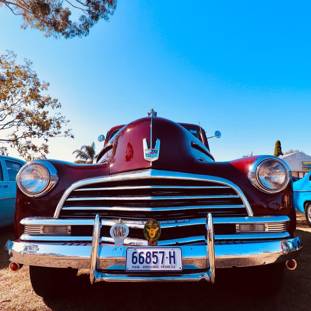 VINTAGE CAR AGAINST CLEAR BLUE SKY