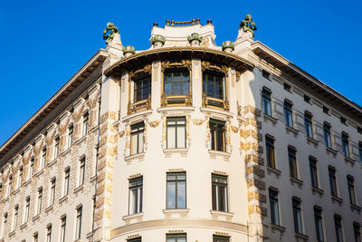 Low angle view of building against blue sky