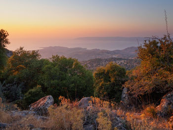 Scenic view of landscape against sky during sunset