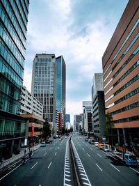 City street and modern buildings against sky