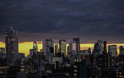 View of skyscrapers lit up at night