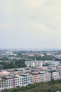 High angle view of buildings in city against sky