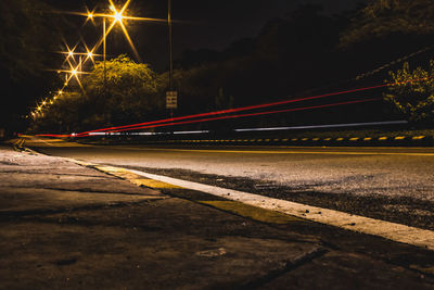 Light trails on road in city at night