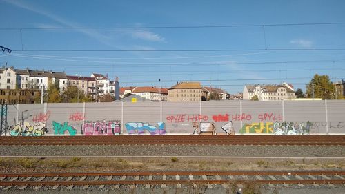 View of railway tracks against buildings