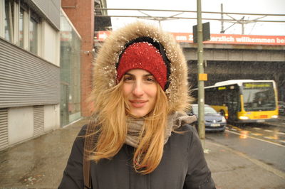 Portrait of smiling young woman in park