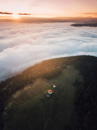 High angle view of car on land against sky during sunset