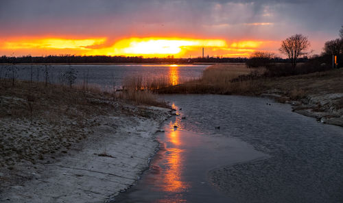 Scenic view of silhouette landscape against sky during sunset