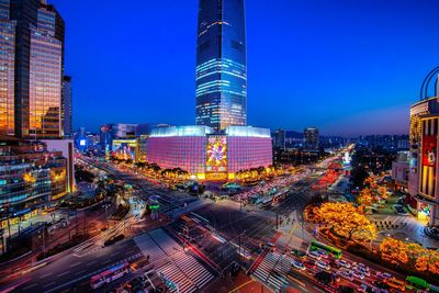 Aerial view of city lit up at night