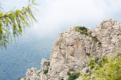 Rock formations on landscape against sky