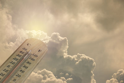 Low angle view of information sign against sky