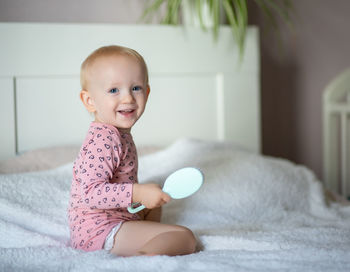 Portrait of cute baby boy at home