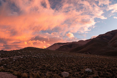 Scenic view of mountains against sky during sunset