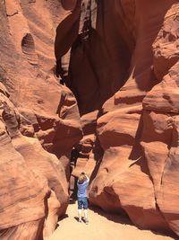 Child photographing rock formation