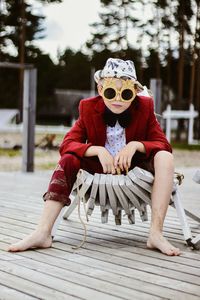 Low section of woman standing on snow