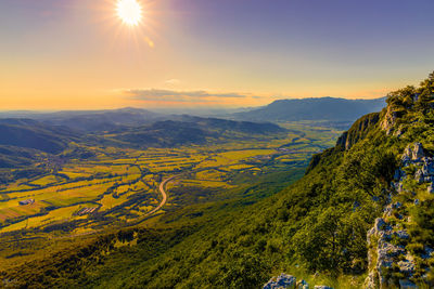 Scenic view of landscape against sky during sunset