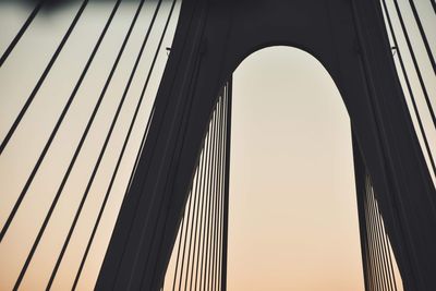 Low angle view of bridge against sky in city
