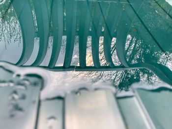 High angle view of chair reflecting on water