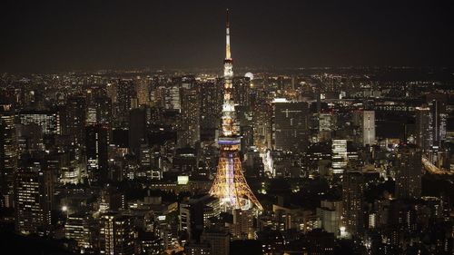 Illuminated buildings in city at night