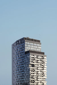 Low angle view of modern building against clear sky