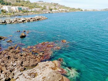 High angle view of rocks in sea