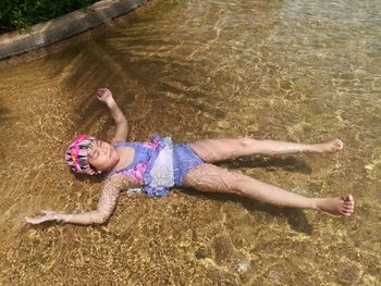 High angle view of girl swimming in pool