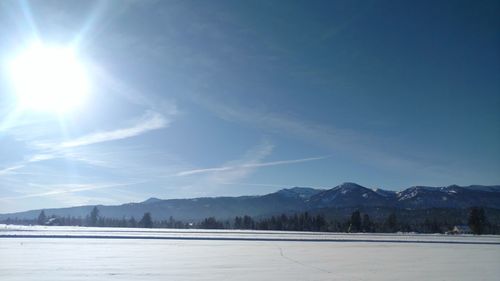 Scenic view of landscape against blue sky