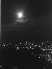 Low angle view of illuminated moon at night