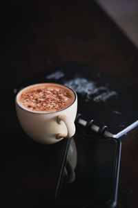 Coffee cup on table