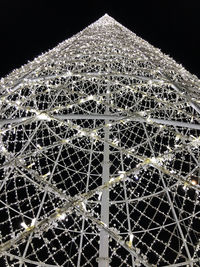 Low angle view of illuminated lights against clear sky