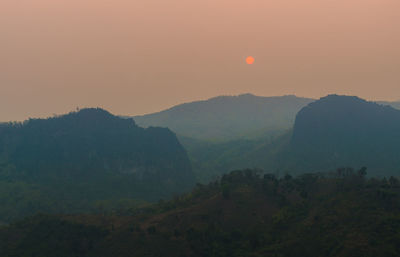 Scenic view of mountains against sky during sunset