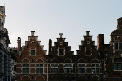 Low angle view of buildings against clear sky