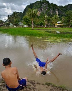 People relaxing on beach