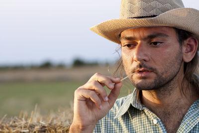 Close-up of man wearing hat