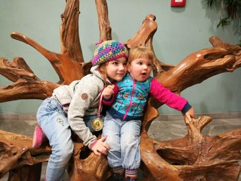 Full length portrait of happy siblings outdoors