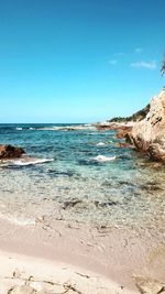 Scenic view of sea against clear blue sky