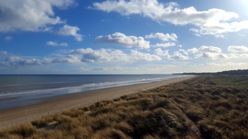 Scenic view of beach against sky