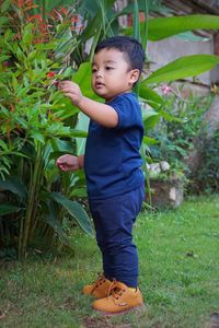 Boy standing on field