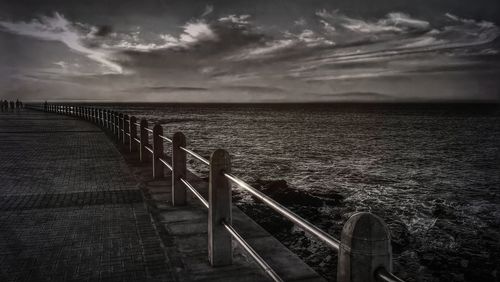 Pier over sea against sky