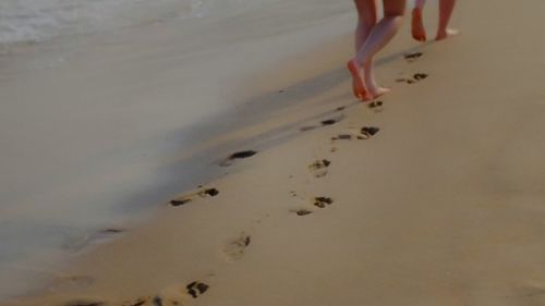 Low section of woman on beach